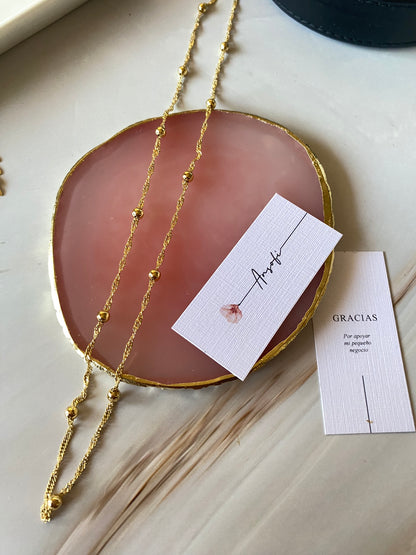 Cadena esferas doradas