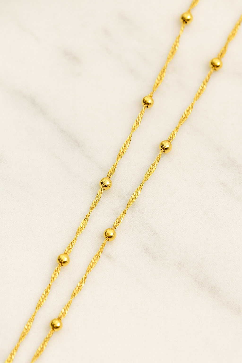 Cadena esferas doradas